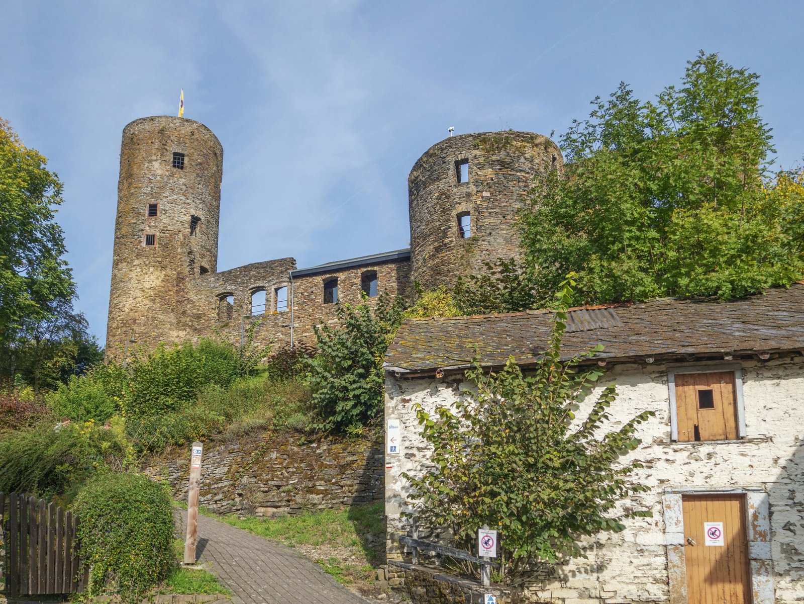 a stone building with two towers on top of it